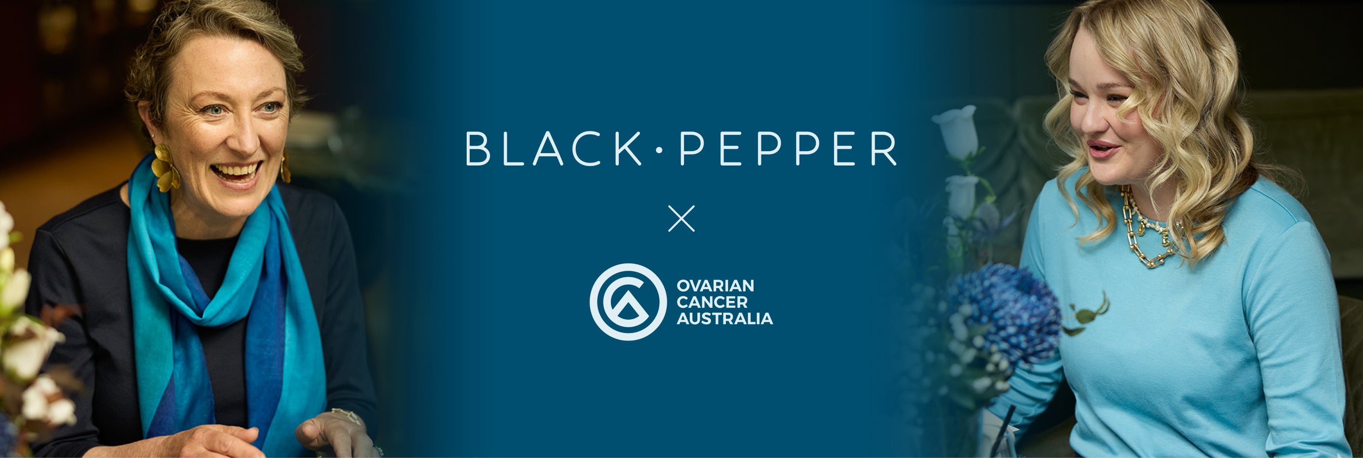 Two women smiling, one with a blue scarf and the other with flowers, against a blue background with 