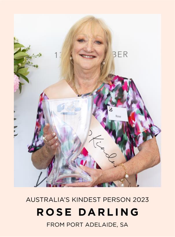 Woman holding an award with 